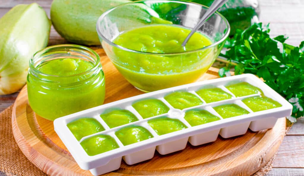 Peas baby food in ice cube trays.