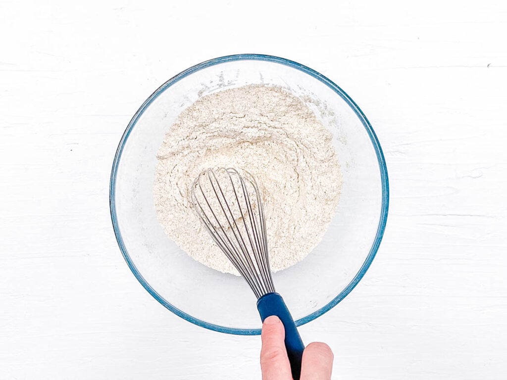 Dry ingredients for cookies whisked in a mixing bowl.