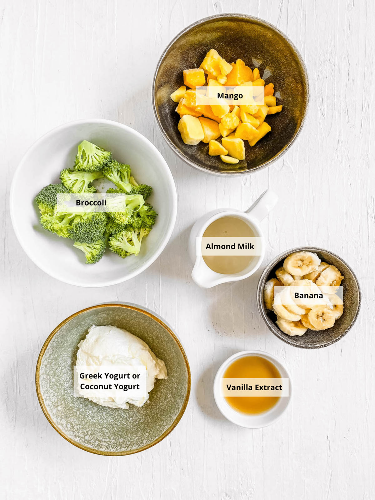 Ingredients for an easy broccoli smoothie recipe on a white background.