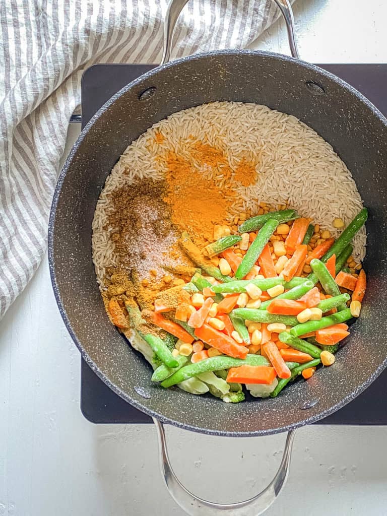 veggies and rice in a pot