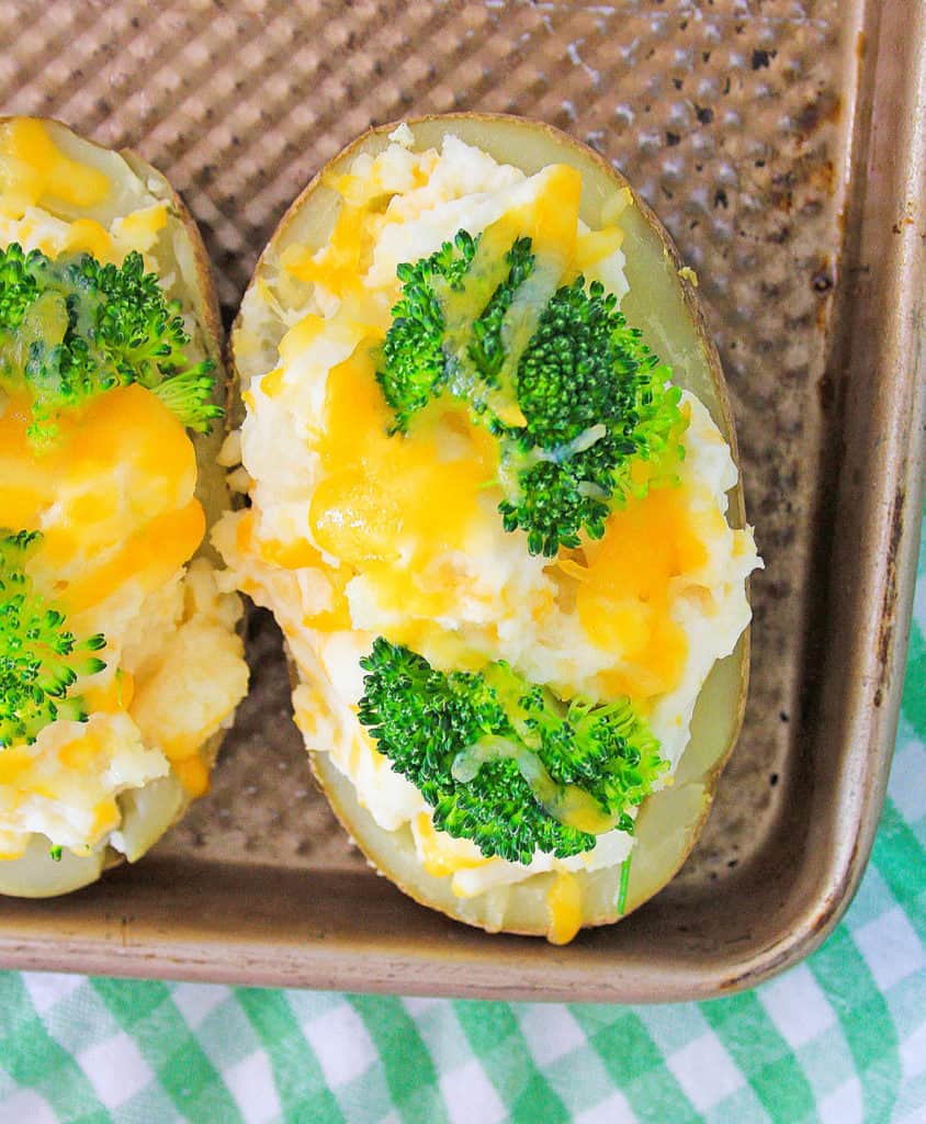 baked potatoes fresh out of the oven on a baking sheet